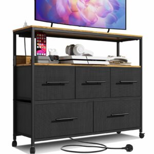 Black chest with 5 fabric drawers, charging station, storage shelf, and wheels
