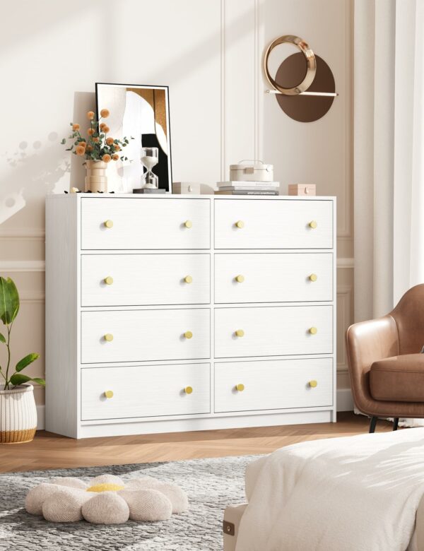 White chest of drawers with 8 fabric drawers and gold handles for elegant storage