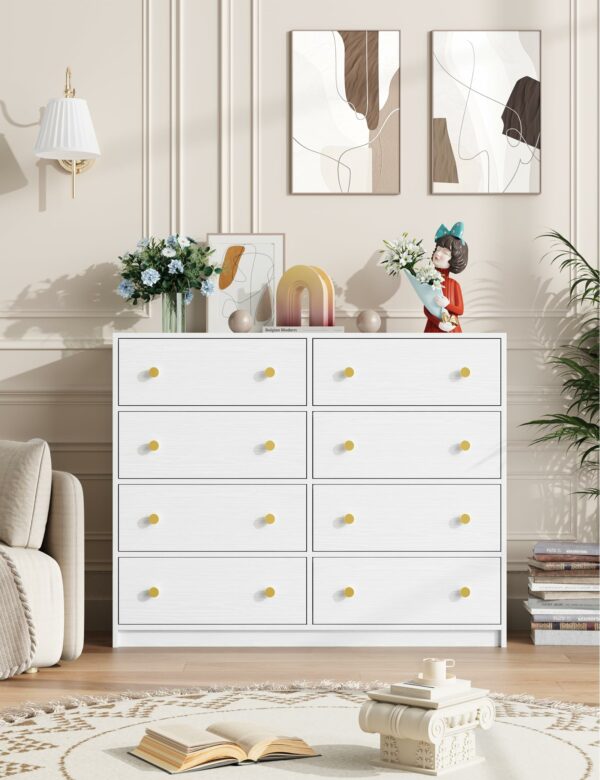 White chest of drawers with 8 fabric drawers and gold handles for elegant storage