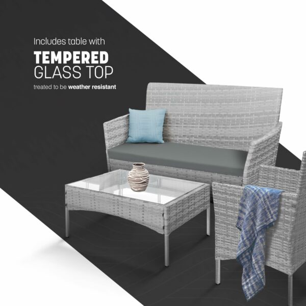 Rattan garden set with lounger, chairs, and table