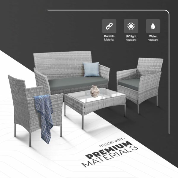 Rattan garden set with lounger, chairs, and table