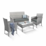 Rattan garden set with lounger, chairs, and table