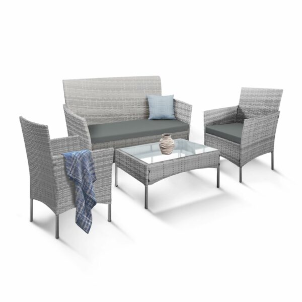 Rattan garden set with lounger, chairs, and table